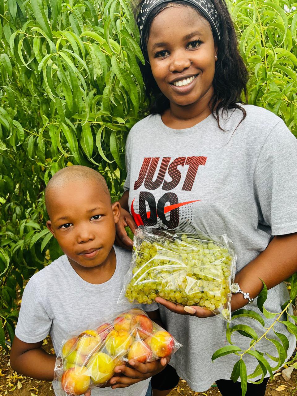 KRS family holding freshly packed farm produce